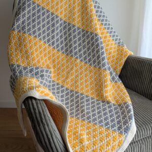 Mosaiik mustris heegeldatud tekk